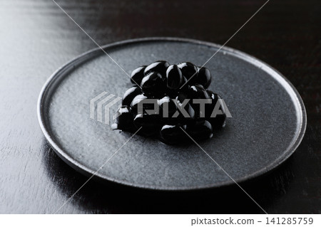 New Year's dishes: Black beans (black background) New Year's dishes: Black beans (black background) 141285759