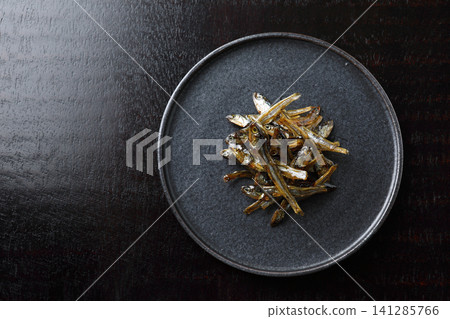 New Year's dishes: Tazukuri (candied sardines) - Black background New Year's dishes: Tazukuri (candied sardines) - Black background 141285766