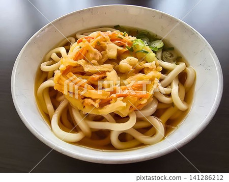 Hot udon noodles with a large tempura fritter Hot udon noodles with a large tempura fritter 141286212