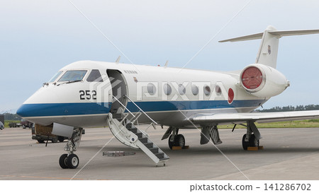 A Japan Air Self-Defense Force U-4 multi-purpose support aircraft parked on the tarmac. A Japan Air Self-Defense Force U-4 multi-purpose support aircraft parked on the tarmac. 141286702