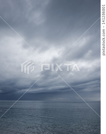 Dramatic sky and peaceful sea at sunrise Dramatic sky and peaceful sea at sunrise 141286801