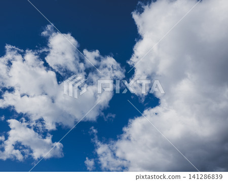 Dramatic cloudscape with puffy clouds Dramatic cloudscape with puffy clouds 141286839