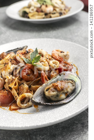 tagliatelle frutti di mare mixed fresh seafood pasta on restaurant table tagliatelle frutti di mare mixed fresh seafood pasta on restaurant table 141286957
