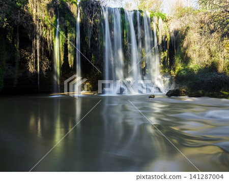 Powerful waterfall surrounded by nature Powerful waterfall surrounded by nature 141287004