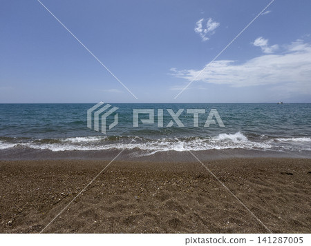 Scenic sunset with calm sea and dramatic clouds Scenic sunset with calm sea and dramatic clouds 141287005