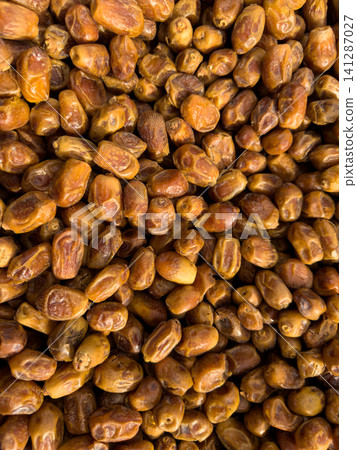 Sweet dried dates at a grocery market stall Sweet dried dates at a grocery market stall 141287027