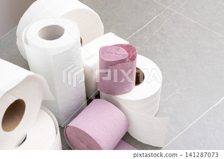 Rolls Of Toilet Paper Towels Hygiene. Roll on gray background Rolls Of Toilet Paper Towels Hygiene. Roll on gray background 141287073