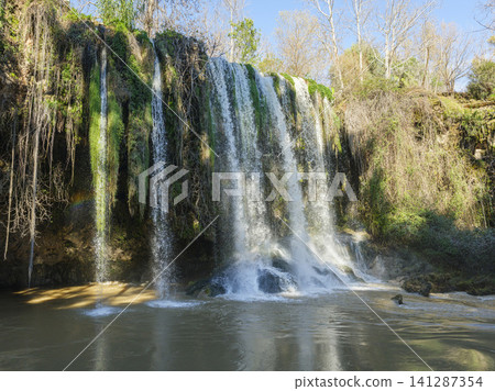 Powerful waterfall surrounded by nature Powerful waterfall surrounded by nature 141287354