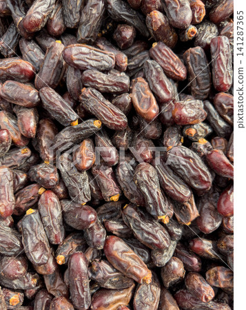 Sweet dried dates at a grocery market stall Sweet dried dates at a grocery market stall 141287365