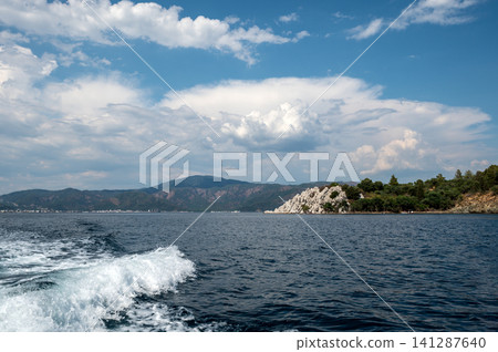 White rocky cliffs and green mountains in Marmaris Turkey White rocky cliffs and green mountains in Marmaris Turkey 141287640