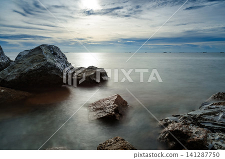 sunset at rocky shore seascape scene sunset at rocky shore seascape scene 141287750