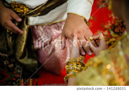 wedding rings together in hands wedding rings together in hands 141288031