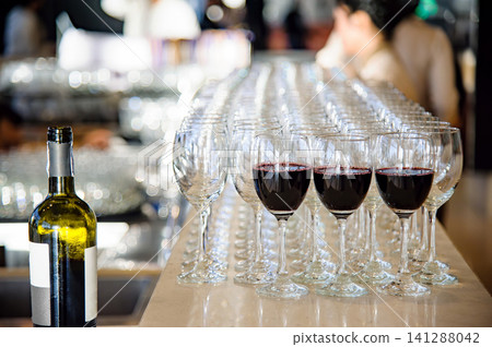 red wine in glasses waiting for dinner party time red wine in glasses waiting for dinner party time 141288042