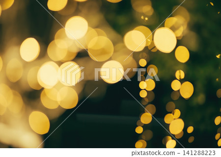 many bokeh from light bulb tubes on a street at night look like luxury golden starlight in a dark background many bokeh from light bulb tubes on a street at night look like luxury golden starlight in a dark background 141288223