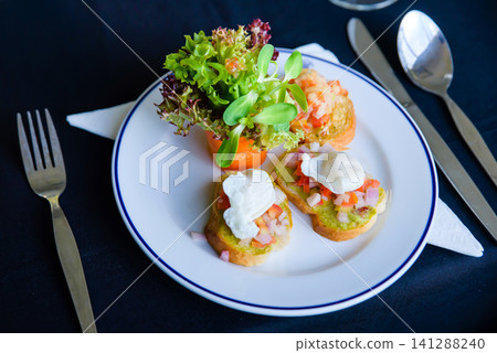 hors d'oeuvres served in a white dish at dinner hors d'oeuvres served in a white dish at dinner 141288240