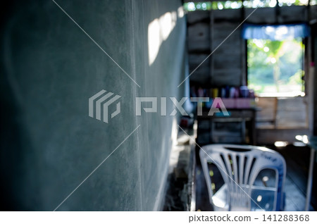 dirty classroom's blackboard in vintage countryside school in Thailand, shot with narrow focusing for background use dirty classroom's blackboard in vintage countryside school in Thailand, shot with narrow focusing for background use 141288368