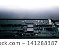 Close-up part of motherboard from laptop computer show up a CPU and other components on board 141288387