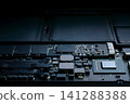 Close-up part of motherboard from laptop computer show up a CPU and other components on board 141288388