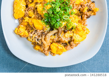 Mapo Egg: Chinese-style egg stir-fry with minced meat and shimeji mushrooms. Mapo Egg: Chinese-style egg stir-fry with minced meat and shimeji mushrooms. 141288518