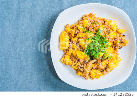 Mapo Egg: Chinese-style egg stir-fry with minced meat and shimeji mushrooms. Mapo Egg: Chinese-style egg stir-fry with minced meat and shimeji mushrooms. 141288522