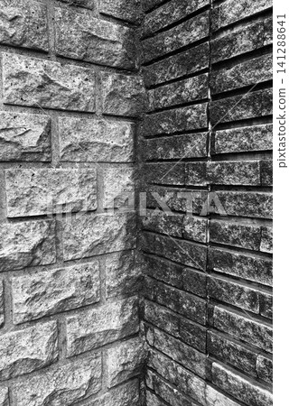 "A monochrome background of a stone wall that evokes a sense of silence and solitude." "A monochrome background of a stone wall that evokes a sense of silence and solitude." 141288641