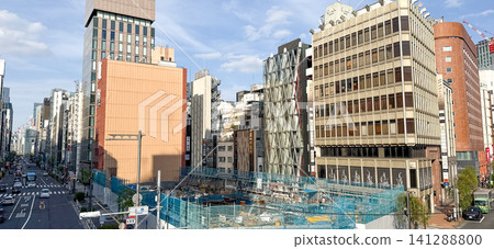 The streets of Shinbashi: A scene of urban skyscrapers and construction sites. The streets of Shinbashi: A scene of urban skyscrapers and construction sites. 141288800