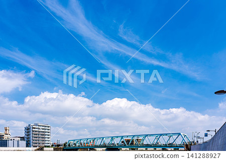 A view along the Nakagawa River in Katsushika under the midsummer sky. A view along the Nakagawa River in Katsushika under the midsummer sky. 141288927
