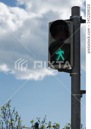 Green color on the traffic light with a beautiful sky Green color on the traffic light with a beautiful sky 141289028