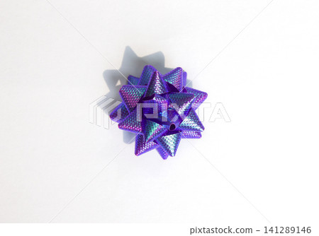 It is a purple star-shaped ribbon. It is a purple star-shaped ribbon. 141289146
