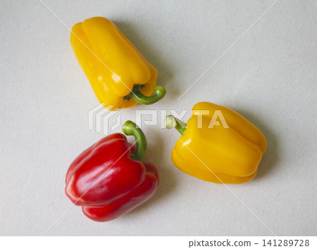 It is a bell pepper placed on a white background. It is a bell pepper placed on a white background. 141289728
