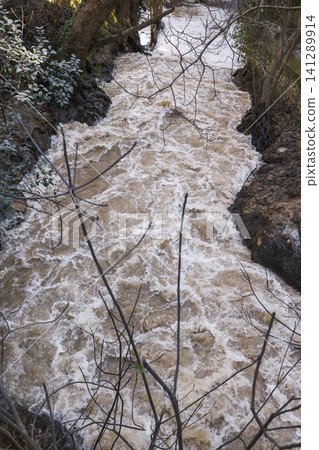 Muddy river after heavy rainfall climate change concept Muddy river after heavy rainfall climate change concept 141289914