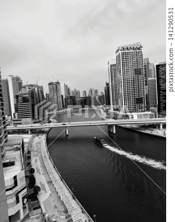 City skyline with tall buildings and river view in daytime City skyline with tall buildings and river view in daytime 141290531