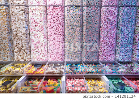 showcase of candy shop, transparent container with various sweets, marshmallow, jelly, chewy gums, rich sugar assortment showcase of candy shop, transparent container with various sweets, marshmallow, jelly, chewy gums, rich sugar assortment 141291124