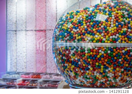 showcase of candy shop, transparent container with various sweets, marshmallow, jelly, chewy gums, rich sugar assortment showcase of candy shop, transparent container with various sweets, marshmallow, jelly, chewy gums, rich sugar assortment 141291128