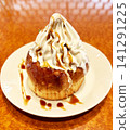 Cinnamon roll with plenty of cream 141291225