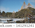 Kenrokuen Garden in winter, depicted against a clear blue sky and white snow, with layers upon layers of snow-covered trees. 141291241