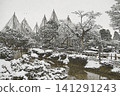 The winter atmosphere of Kenrokuen Garden, with its snow-covered trees and gently flowing water. 141291243