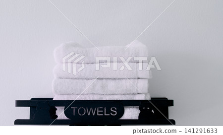 towels on wooden shelf 141291633