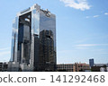 Neighboring buildings reflected on the exterior wall of the building 141292468