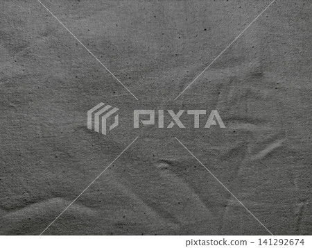 dark charcoal gray wrinkled cotton fabric texture background showing organic woven linen fibers dark charcoal gray wrinkled cotton fabric texture background showing organic woven linen fibers 141292674