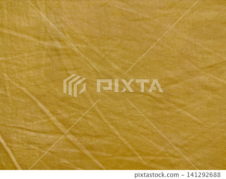 mustard yellow textured fabric background with natural organic creasing and subtle linen material weave for sustainable design mustard yellow textured fabric background with natural organic creasing and subtle linen material weave for sustainable design 141292688