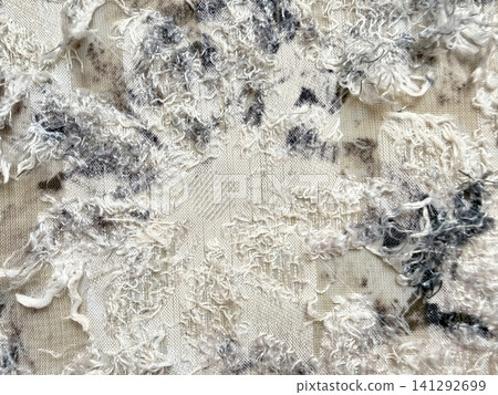 textured abstract fabric background with frayed white and grey threads creating an intricate organic pattern textured abstract fabric background with frayed white and grey threads creating an intricate organic pattern 141292699