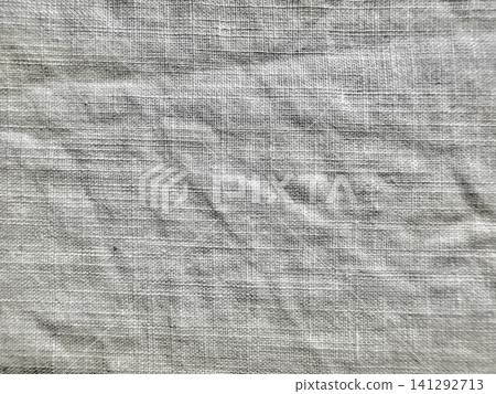 grey textured linen fabric background with subtle organic wrinkles in natural monochrome light for minimalist design grey textured linen fabric background with subtle organic wrinkles in natural monochrome light for minimalist design 141292713