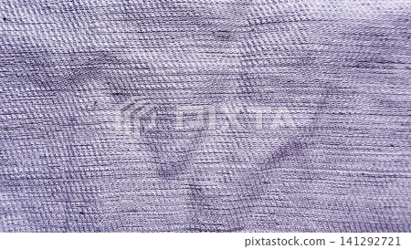 close up view of textured purple cotton fabric showing detailed woven thread patterns in abstract minimalistic styling close up view of textured purple cotton fabric showing detailed woven thread patterns in abstract minimalistic styling 141292721