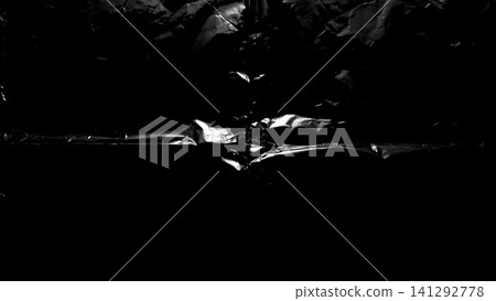 dark abstract texture with crumpled black plastic wrap reflecting bright studio light creating a moody cinematic backdrop dark abstract texture with crumpled black plastic wrap reflecting bright studio light creating a moody cinematic backdrop 141292778