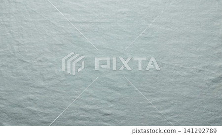 sage green linen fabric texture reveals organic woven yarn fiber in a minimalist serene flat lay composition 141292789