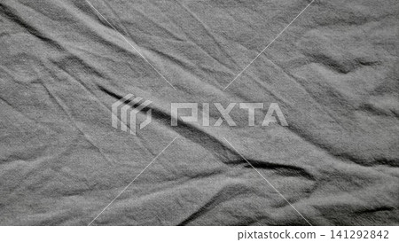 charcoal gray linen fabric texture with organic creases creates a serene minimalist backdrop for sustainable design charcoal gray linen fabric texture with organic creases creates a serene minimalist backdrop for sustainable design 141292842