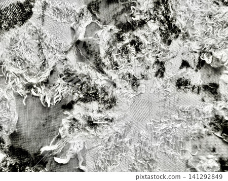 monochrome macro texture of distressed jacquard fabric reveals intricate frayed threads creating abstract moody depth monochrome macro texture of distressed jacquard fabric reveals intricate frayed threads creating abstract moody depth 141292849