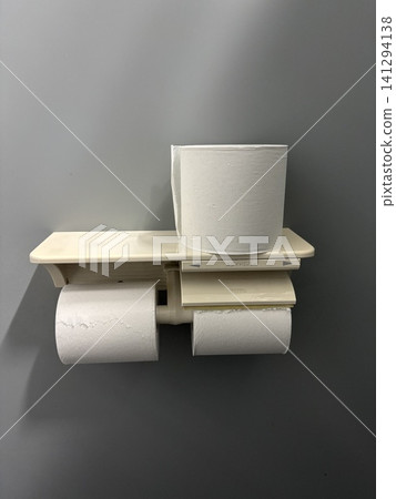 Toilet paper holder and spare toilet paper; simple toilet storage; interior amenities. Toilet paper holder and spare toilet paper; simple toilet storage; interior amenities. 141294138
