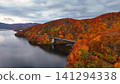 Aerial view of the beautiful arch bridge over Lake Akimoto and the autumn foliage. Aerial view of the beautiful arch bridge over Lake Akimoto and the autumn foliage. 141294338